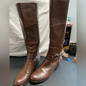 Brown riding boots with gold buckle